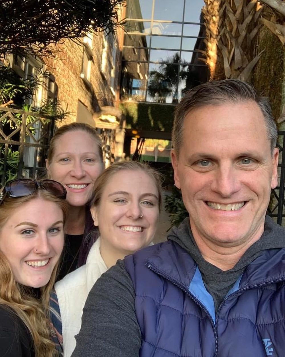 Jimmy taking a selfie with his family on a Charleston street